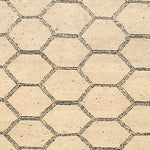 Woven rug swatch in a linear honeycomb pattern in black on a tan field.