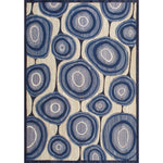 Rectangular in an abstract circular pattern reminiscent of lollipops in shades of blue and gray on a tan field.
