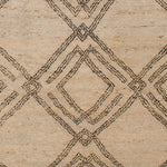 Woven high-pile rug swatch in a large-scale interlocking diamond pattern in black on a cream field.