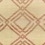 Woven high-pile rug swatch in a large-scale interlocking diamond pattern in red on a cream field.