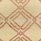 Woven high-pile rug swatch in a large-scale interlocking diamond pattern in red on a cream field.