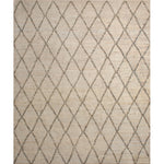 Rectangular high-pile woven rug in a large scale diamond pattern in black on a tan field.