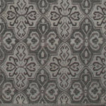Woven rug swatch in a repeating floral paisley in shades of gray.