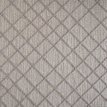 Wool-blend broadloom carpet swatch in a dimensional lattice print in gray on a mottled gray field.