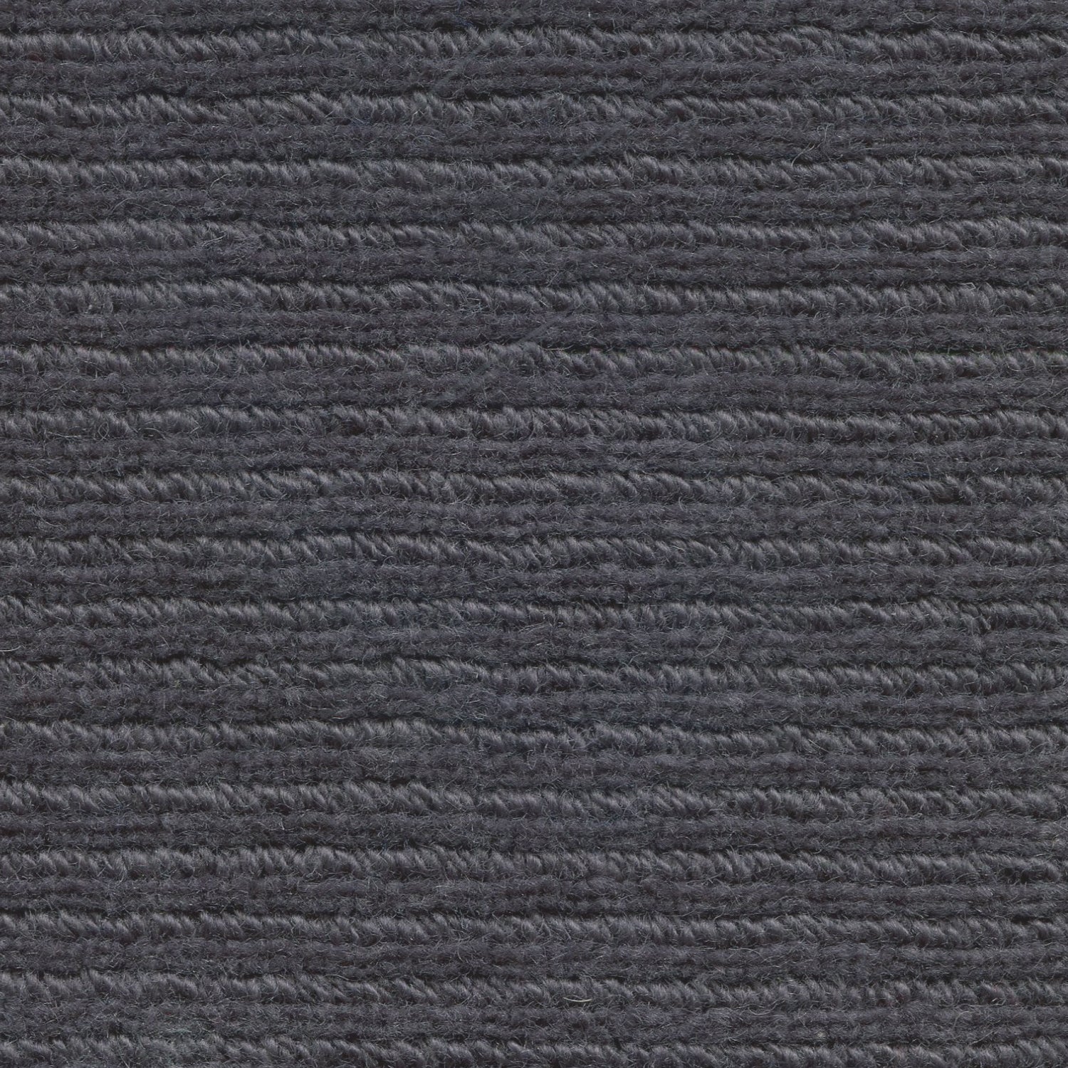 Wool broadloom carpet swatch in a chunky ribbed weave in charcoal.
