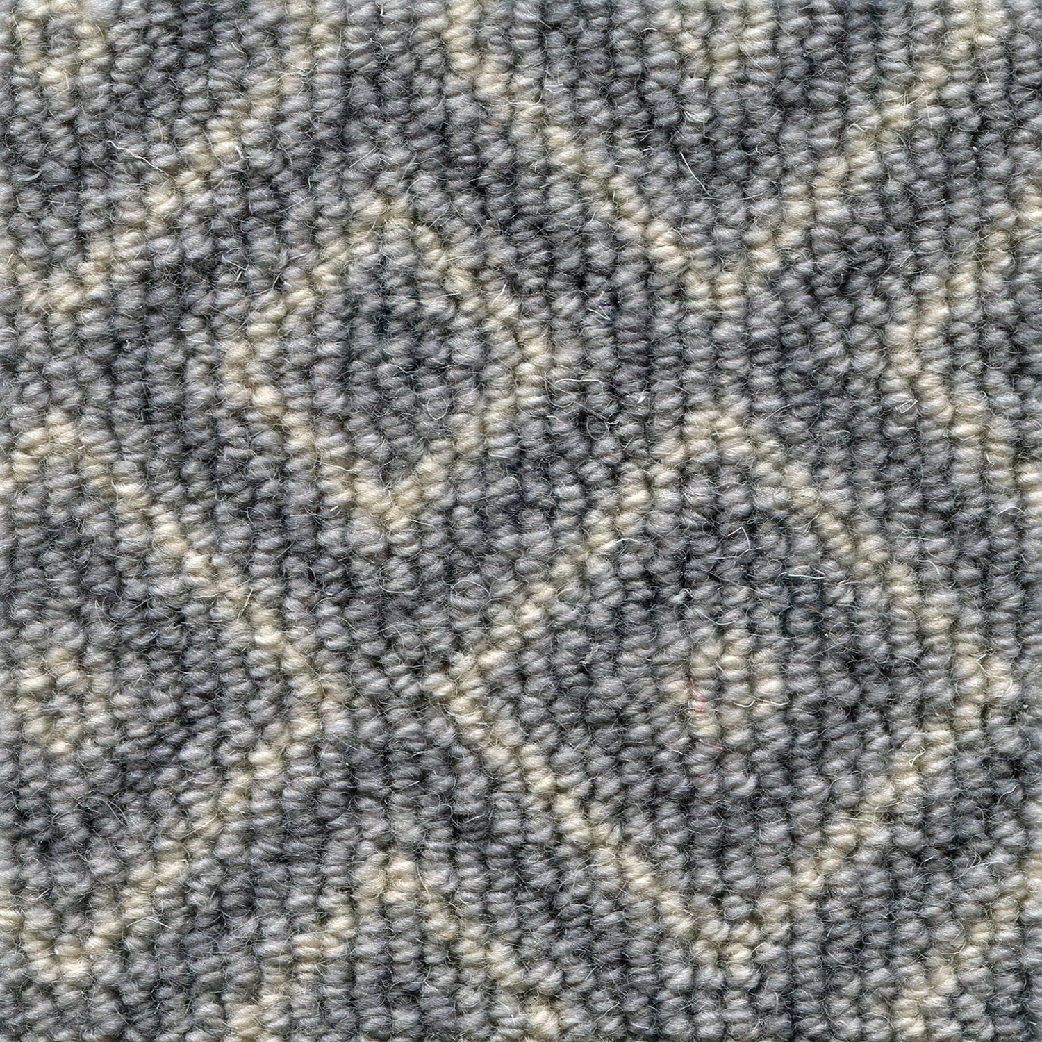 Wool broadloom carpet swatch in a repeating diamond pattern in tan on a gray field.