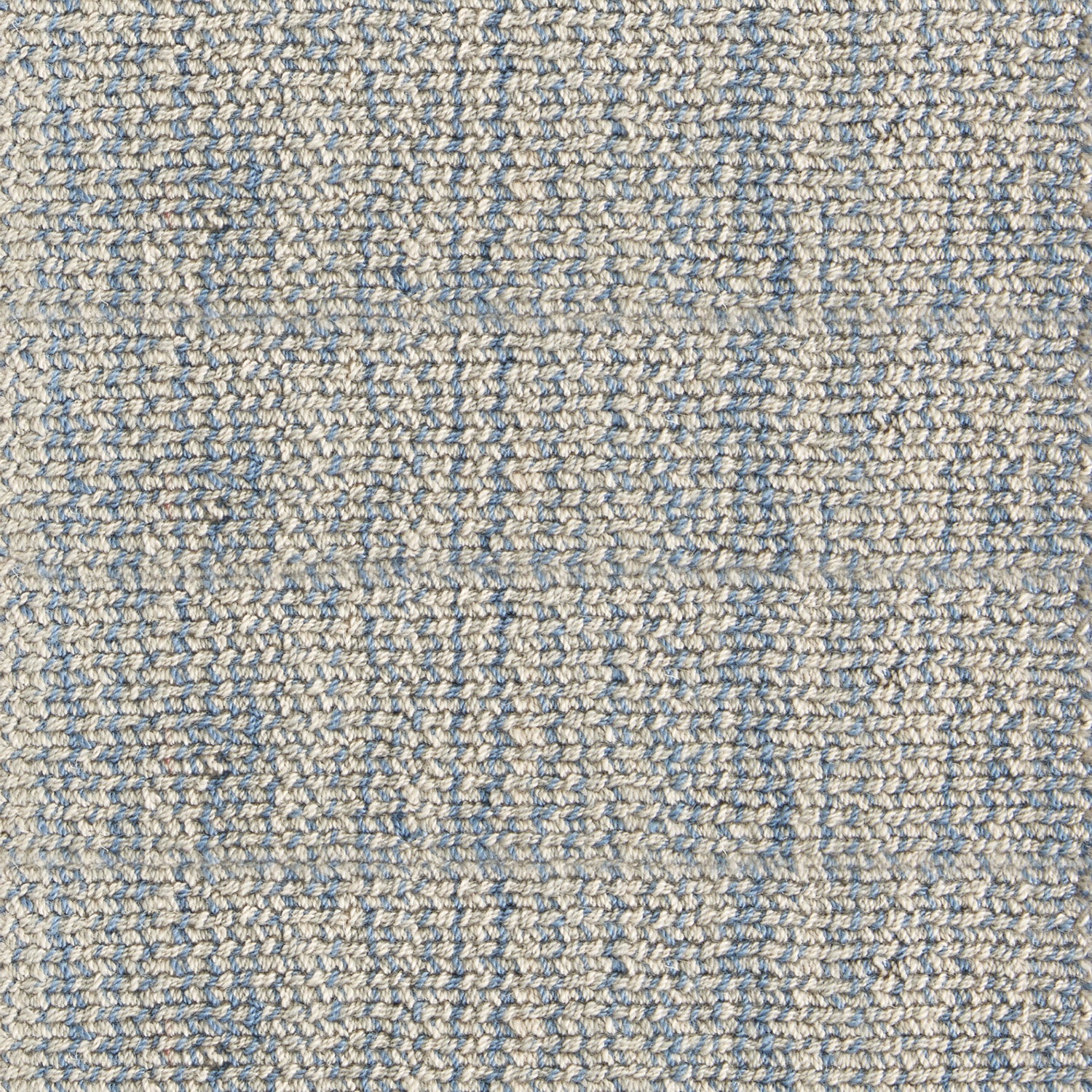 Nylon broadloom carpet swatch in a ribbed weave in mottled tan and blue.