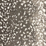 Wool broadloom carpet swatch in a white leopard print on an ombré background of greige and gray.