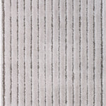 Wool-blend broadloom carpet swatch in a dimensional ribbed weave in greige and gray.