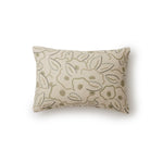 A rectangular throw pillow in a large-scale minimal floral print in shades of tan and green on a cream background.
