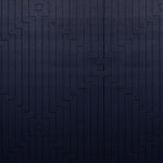 Wool-silk broadloom carpet swatch in a dimensional geometric weave in navy.