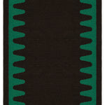 Detail of the Waver Rug in Modernist Green, a solid black field with a green flame stitch border. 