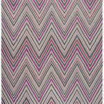 Zig Zag Rug in Ruby-Rose, a mutli color zig zag pattern in fucshia, magenta, link and charcoal on a white field with a tassled edge. 