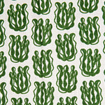 Woven fabric swatch with a repeating cartoon seaweed print in green on a white background.